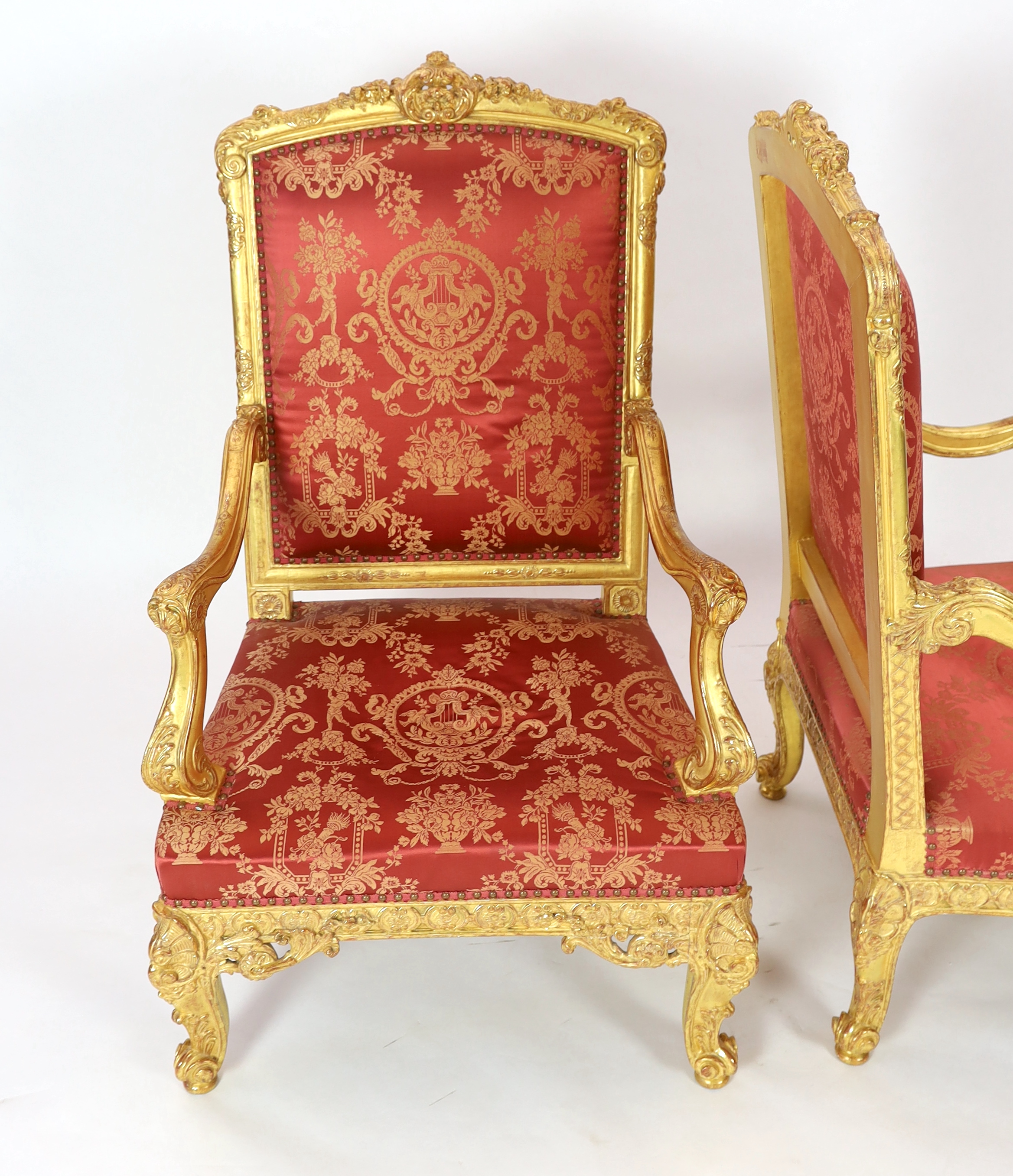 A pair of Louis XV style carved giltwood fauteuils Please note this lot attracts an additional import tax of 5% on the hammer price